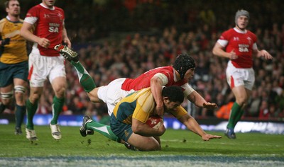 28.11.09  Wales v Australia... Australia's Tatafu Polota-Nau  scores try despite tackle by Tom James.. 