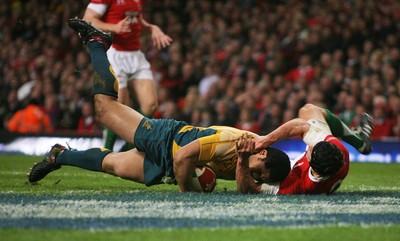 28.11.09  Wales v Australia... Australia's Tatafu Polota-Nau  scores try despite tackle by Tom James.. 