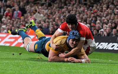 28.11.09 - Invesco Perpetual International Rugby, Wales v Australia Australia's James Horwill geat past Wales' Leigh Halfpenny to score try 