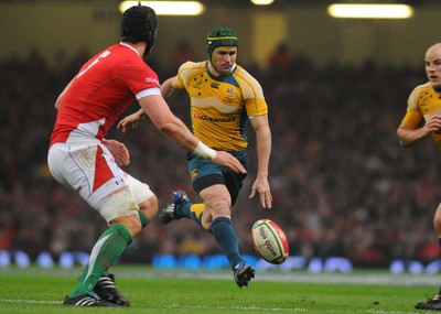 28.11.09 - Invesco Perpetual International Rugby, Wales v Australia Australia's Matt Giteau chips ahead, past Wales' Luke Charteris 