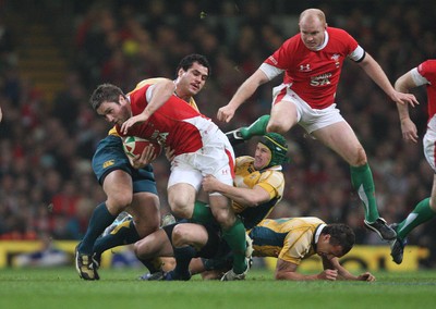 28.11.09... Wales v Australia, Invesco Perpetual 2009 Series -  Wales' Andrew Bishop is hauled down by the Australian defence 