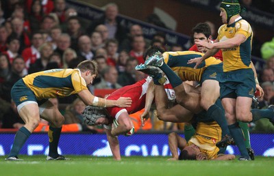 28.11.09... Wales v Australia, Invesco Perpetual 2009 Series -  Wales' Jonathan Davies is brought down 