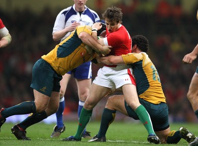 28.11.09... Wales v Australia, Invesco Perpetual 2009 Series -  Wales' Martin Roberts is tackled by Australia's Benn Robinson and George Smith  