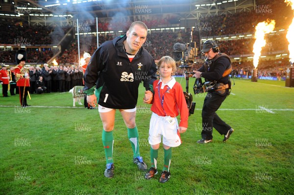 28.11.09 - Wales v Australia - Invesco Perpetual Series 2009 - Wales captain Gethin Jenkins leads out his team with mascot Tomas Bennett. 
