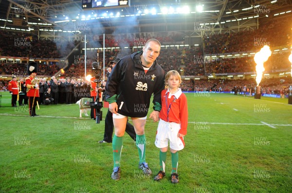 28.11.09 - Wales v Australia - Invesco Perpetual Series 2009 - Wales captain Gethin Jenkins leads out his team with mascot Tomas Bennett. 