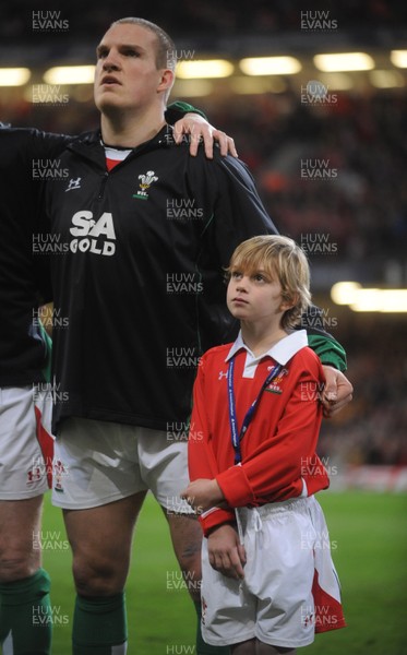 28.11.09 - Wales v Australia - Invesco Perpetual Series 2009 - Mascot Tomas Bennett lines up for the national anthems with Gethin Jenkins. 