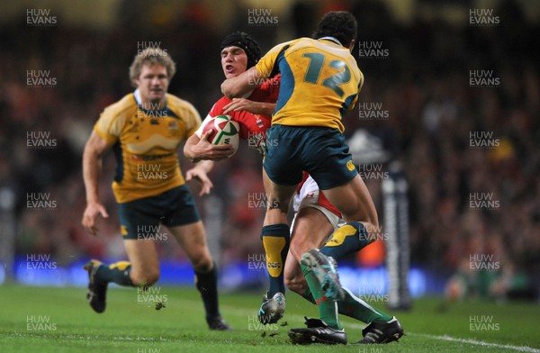 28.11.09 - Wales v Australia - Invesco Perpetual Series 2009 - Wales' Tom James is tackled by Australia's Quade Cooper. 