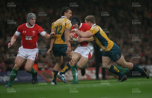 28.11.09  Wales v Australia... Wales' Leigh Halfpenny is tackled by Australia's David Pocock .. 