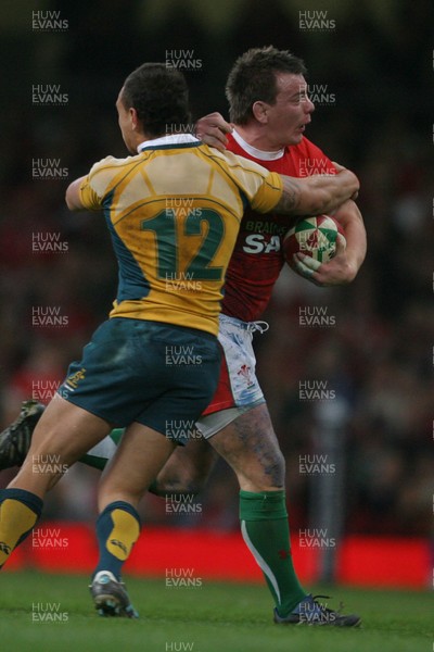 28.11.09  Wales v Australia... Wales' Matthew Rees is tackled by Australia's Quade Cooper. 