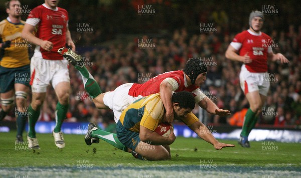 28.11.09  Wales v Australia... Australia's Tatafu Polota-Nau  scores try despite tackle by Tom James.. 