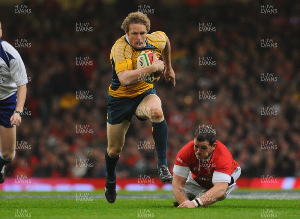 28.11.09 - Invesco Perpetual International Rugby, Wales v Australia Australia's Peter Hynes  gets past a tackle from Wales' Paul James 