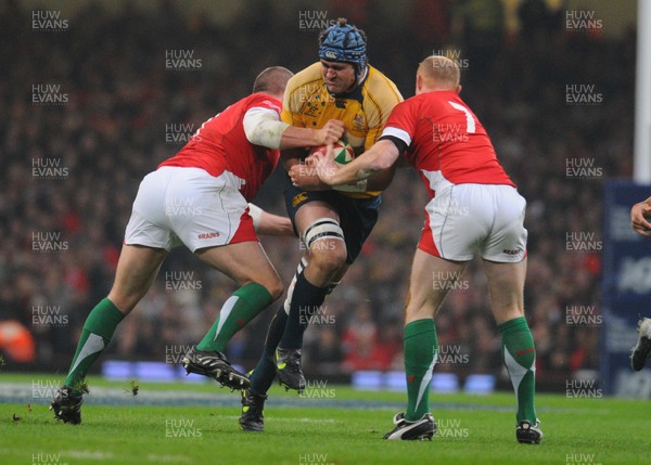 28.11.09 - Invesco Perpetual International Rugby, Wales v Australia Australia's James Horwill is tackled by Wales' Gethin Jenkins and Martyn Williams 
