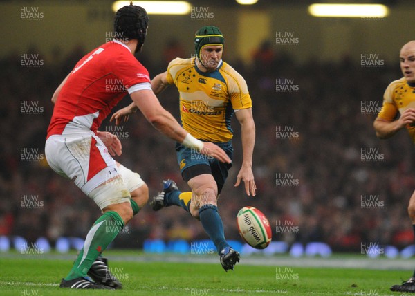 28.11.09 - Invesco Perpetual International Rugby, Wales v Australia Australia's Matt Giteau chips ahead, past Wales' Luke Charteris 