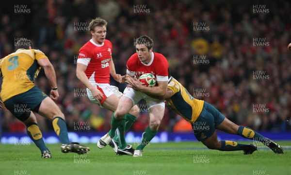 28.11.09... Wales v Australia, Invesco Perpetual 2009 Series -  Wales' Andrew Bishop is tackled by Australia's Will Genia  