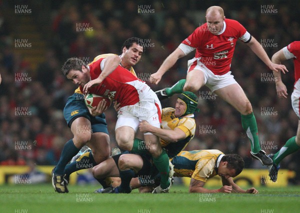 28.11.09... Wales v Australia, Invesco Perpetual 2009 Series -  Wales' Andrew Bishop is hauled down by the Australian defence 