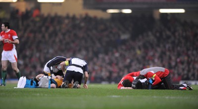 29.11.08 - Wales v Australia - Invesco Perpetual Series 2008 - Wales' Jamie Roberts  and Australia's Stirling Mortlock are treated after a colliding. 