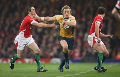 29.11.08 ... Wales v Australia, Invesco Perpetual Series 2008. -  Australia's Ryan Cross hands off Wales' Andrew Bishop  