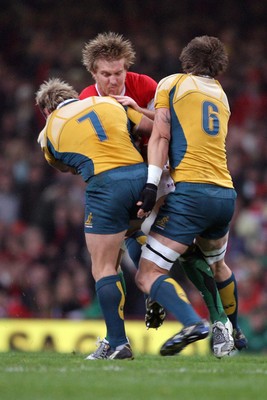 29.11.08 Wales v Australia... Wales' Andy Powell  is tackled by Australia's Hugh McMeniman and Phil Waugh. 