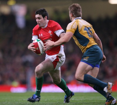 29.11.08 Wales v Australia... Wales' Stephen Jones takes on Australia's Drew Mitchell. 