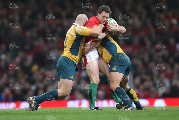 29.11.08 ... Wales v Australia, Invesco Perpetual Series 2008. -  Wales' Mark Jones is tackled by Australia's Phil Waugh and Stephen Moore  