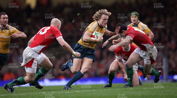 29.11.08 Wales v Australia... Australia's Ryan Cross is tackled by Stephen Jones 