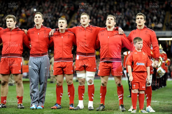 301113 - Wales v Australia - Dove Men Series 2013 -Rhodri Jones, George North, Scott Williams, Dan Lydiate, Gethin Jenkins and Sam Warburton stand with mascot during the national anthems