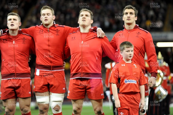 301113 - Wales v Australia - Dove Men Series 2013 -Scott Williams, Dan Lydiate, Gethin Jenkins and Sam Warburton stand with mascot during the national anthems