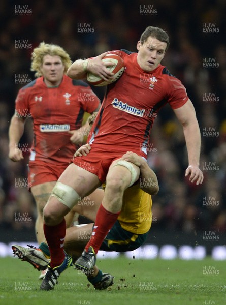 301113 - Wales v Australia - Dove Men Series 2013 -Ian Evans of Wales is tackled by Nick Cummins of Australia