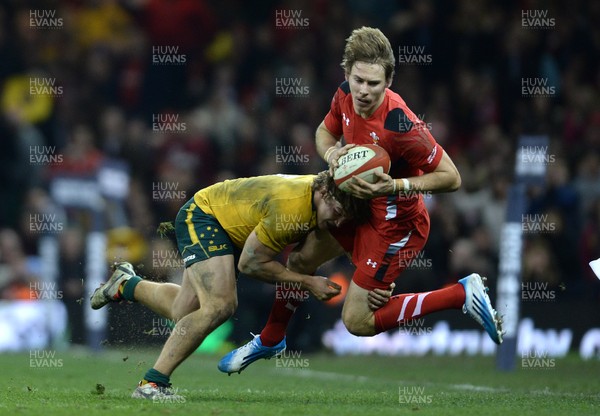 301113 - Wales v Australia - Dove Men Series 2013 -Liam Williams of Wales is tackled by Nick Cummins of Australia