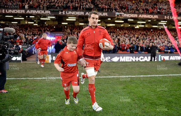 301113 - Wales v Australia - Dove Men Series 2013 -Sam Warburton of Wales leads his side out with mascot