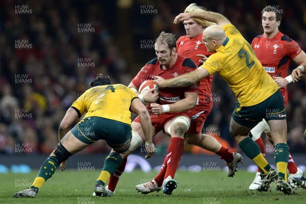 301113 - Wales v Australia - Dove Men Series 2013 -Alun Wyn Jones of Wales is tackled by James Slipper and Stephen Moore of Australia