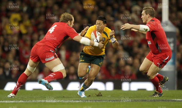 301113 - Wales v Australia - Dove Men Series - Christian Leali-ifano of Australia is tackled by Alun Wyn Jones and Gethin Jenkins of Wales 