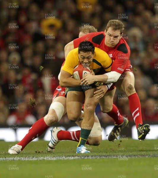 301113 - Wales v Australia - Dove Men Series - Christian Leali-ifano of Australia is tackled by Alun Wyn Jones and Gethin Jenkins of Wales 