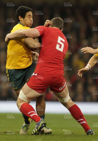 301113 - Wales v Australia - Dove Men Series - Rob Simmons of Australia is tackled by Ian Evans of Wales 