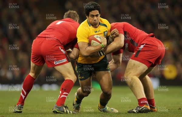 301113 - Wales v Australia - Dove Men Series - Rob Simmons of Australia is tackled by Gethin Jenkins and Alun Wyn Jones of Wales 