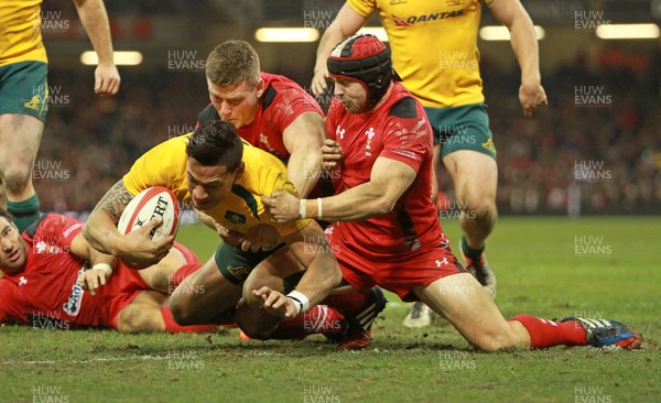 301113 - Wales v Australia - Dove Men Series - Israel Folau of Australia gets past Scott Williams and Leigh Halfpenny of Wales to score 