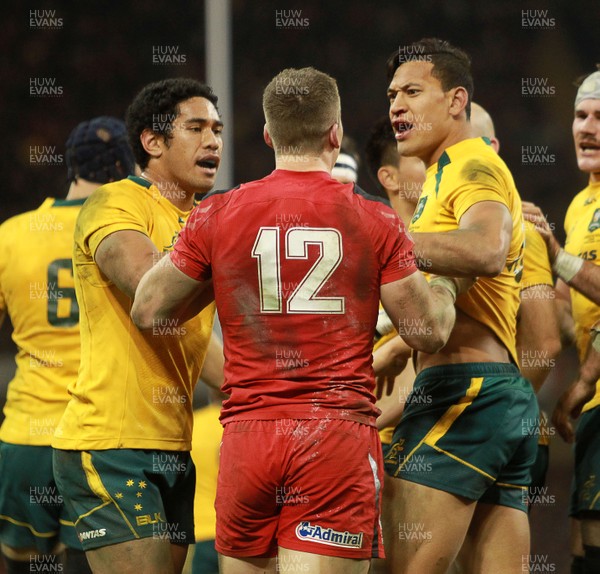 301113 - Wales v Australia - Dove Men Series - Scott Williams of Wales has words with Joe Tomane and Israel Folau of Australia after he scored 