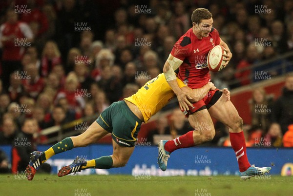 301113 - Wales v Australia - Dove Men Series - George North of Wales is tackled by Christian Leali-ifano of Australia  