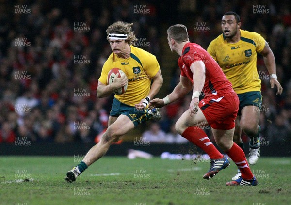 301113 - Wales v Australia - Dove Men+Care Series - Nick Cummins of Australia takes on Scott Williams of Wales