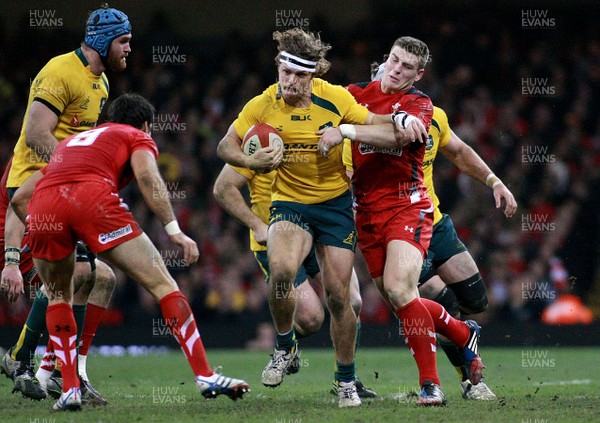 301113 - Wales v Australia - Dove Men+Care Series - Nick Cummins of Australia takes on Scott Williams of Wales