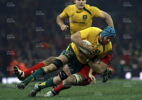 301113 - Wales v Australia - Dove Men+Care Series - James Horwill of Australia is tackled by Toby Faletau of Wales