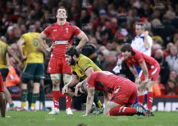 301113 - Wales v Australia - Dove Men+Care Series - Scott Williams(kneeling) and Sam Warburton of Wales are dejected at the final whistle