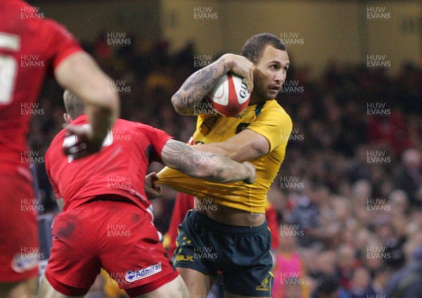 301113 - Wales v Australia - Dove Men+Care Series - Quade Cooper of Australia is tackled by Scott Williams of Wales