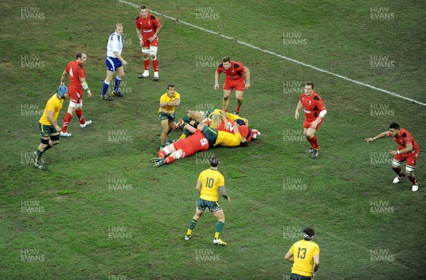 301113 - Wales v Australia - Dove Mens Series -Will Genia of Australia passes the ball out of the ruck