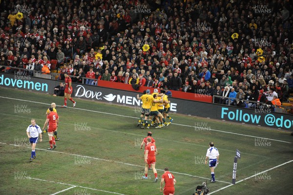 301113 - Wales v Australia - Dove Mens Series -Australia celebrate their try in front of fans in the lower tier of the Millenium Stadium