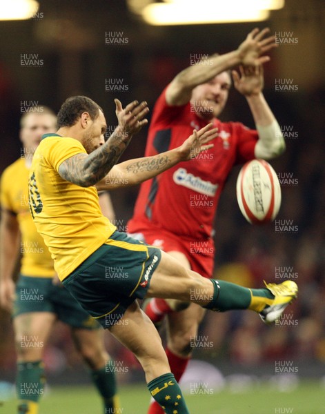 301113 - Wales v Australia, Dove Men Care Autumn Series - Gethin Jenkins of Wales attempts to charge down Quade Cooper of Australia's kick