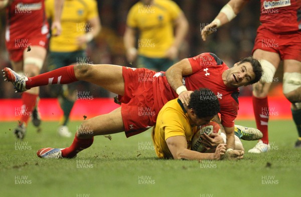 301113 - Wales v Australia, Dove Men Care Autumn Series - Mike Phillips of Wales tackles Joe Tomane of Australia