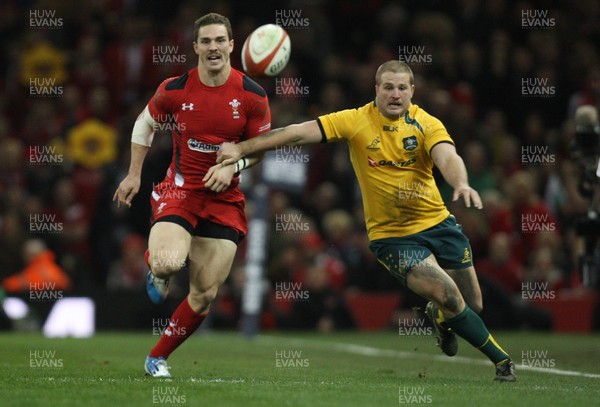 301113 - Wales v Australia, Dove Men Care Autumn Series - George North of Wales and James Slipper of Australia chase the kick ahead