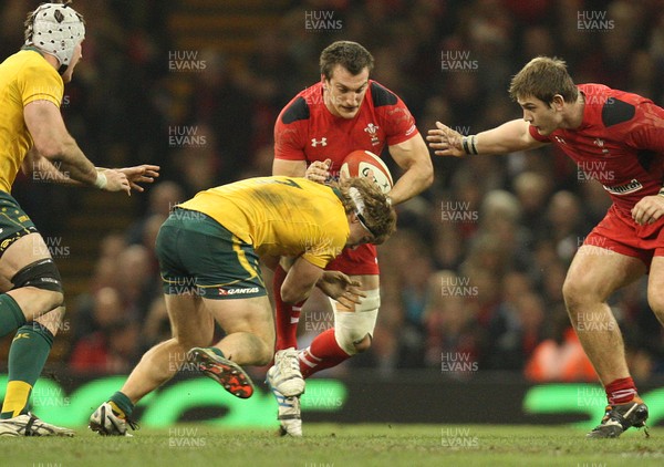 301113 - Wales v Australia, Dove Men Care Autumn Series - Sam Warburton of Wales is tackled by Michael Hooper of Australia