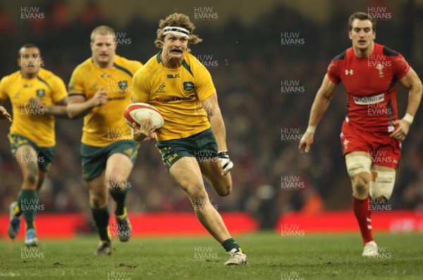 301113 - Wales v Australia, Dove Men Care Autumn Series - Nick Cummins of Australia races towards the line